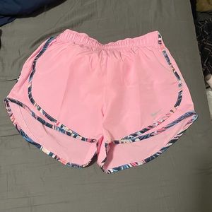 Pink women’s Nike running shorts